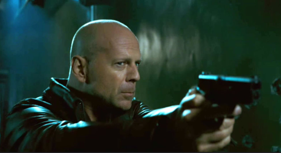 Bruce Willis se zbraní 